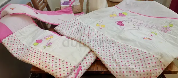 Pink baby bedding set — quilt and bumper, gently used. 3 pieces