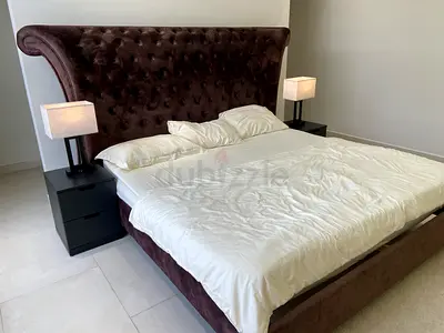 King-size tufted velvet bed without nightstands