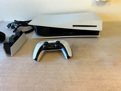 PlayStation 5 Console with DualSense Controller, charging stand and some games