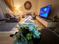 Two bedrooms and a living room in Al Taawun Tower, Amisa 5500 with internet