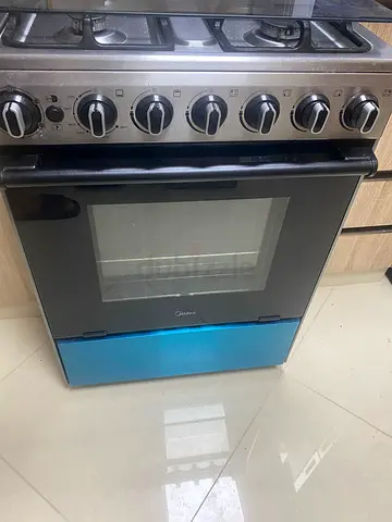 6-Burner Stainless Steel Gas Range with Built-in Oven (Good Condition)+ cylinder