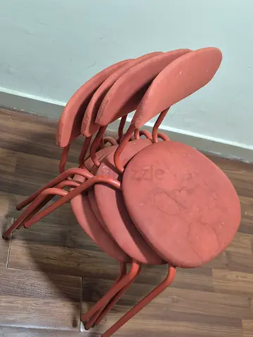 Set of 4 Stackable Rust-Colored Metal Dining/Counter Stools