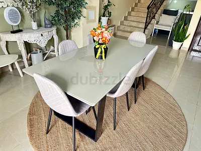 Modern Glass Top Dining Table with 6 Upholstered Chairs. 180cm x 80cm