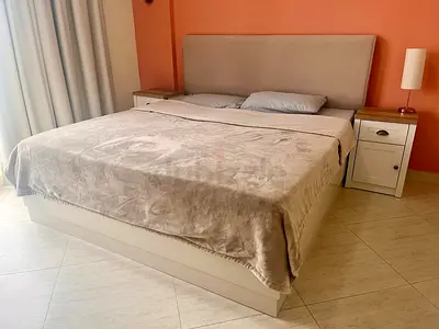 King-size storage bed + 2 nightstands