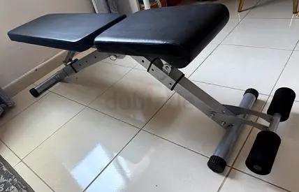 Adjustable workout bench – flat/incline with leg support (good condition)