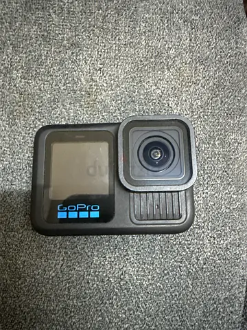 GoPro HERO action camera (used) with protective lens cover