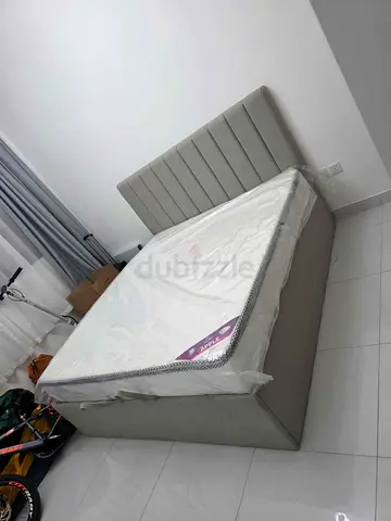 Queen upholstered bed frame with storage - light grey, like new