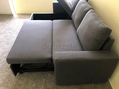 Gray Fabric Sofa Bed with Storage Arm and Pull-Out Bed