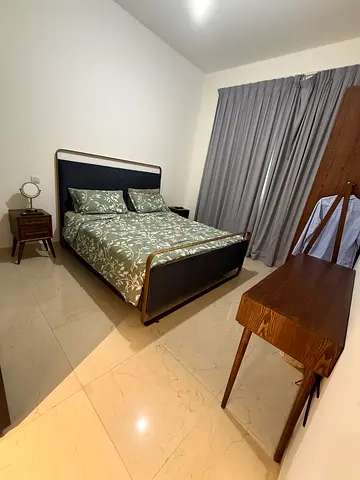 Selling a full bedroom set comprising a king‑size bed with built‑in storage, a matching nightstand,
