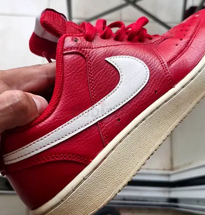 Red leather low-top sneakers (mens) – lightly used