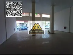 A commercial shop for annual rent in Al Mowaihat 2 – Ajman, featuring a large space and a prime lo