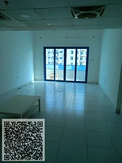 Studio apartment for annual rent in Falcon Towers, Al Rashidiya 2, Ajman, with parking and balcony.