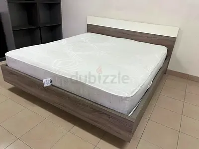 Home Centre double wooden bed with white mattress