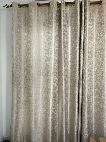 Beige patterned fabric curtains / Roman blinds in good condition (3 curtain holders and 6 curtains)