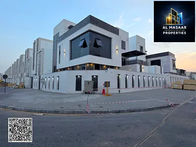 Corner apartment with 6 bedrooms, including electricity, water, air conditioning, elevator, and registration fees, in one of Ajman's most prestigious