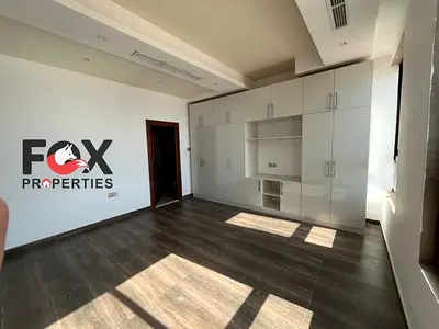 A two-bedroom apartment with a living room in the Al Hamidiya area - Ajman. It features a ventilated balcony and an excellent view. It has built-in wa