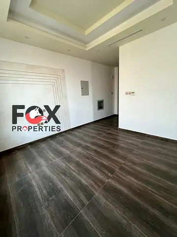 A two-bedroom apartment with a living room in the Al Hamidiya area - Ajman. It features a ventilated balcony and an excellent view. It has built-in wa
