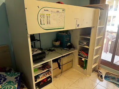 White wooden loft bed with built-in desk and shelving - used