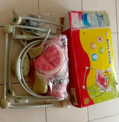 Lightly used baby swing with original box (pink)