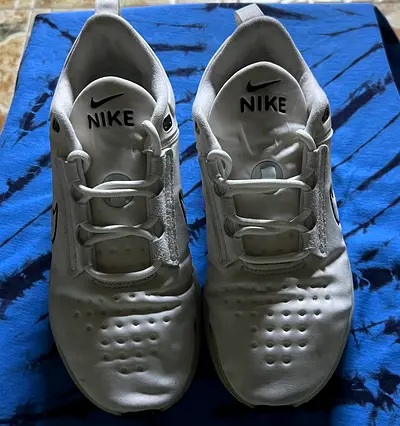 Pair of white Nike sneakers, lightly used