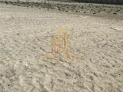 Land for sale in Al Samha, located in a strategic and rapidly developing area, offering a commercial