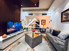 Two bedrooms and a living room in Al Khan with a balcony and three bathrooms. Rent 5000, deposit 100