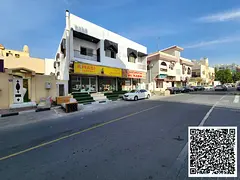Building for Sale in Al Nuaimiya – High Investment Return (4 Apartments + 3 Shops)