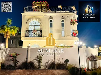 In Al Bahia area, Ajman, a corner villa with two floors and a roof, fully air-conditioned, freehold ownership for all nationalities.