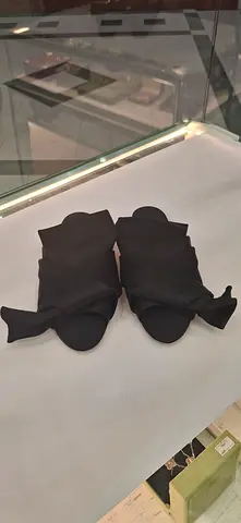 Black womens bow slide sandals, size unknown - gently used