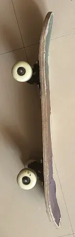 Used street skateboard with worn deck and wheels — good for practice
