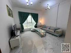 Luxury one-bedroom apartment with a living room, balcony, gym, and swimming pool. Ajman, Oasis Tower