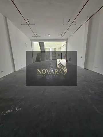 Warehouse for rent in Al Jurf Industrial Area 3, Ajman, on a main road, 3,000 sq ft with mezzanine, 32 kW electricity, 12m height, rent AED 150,000