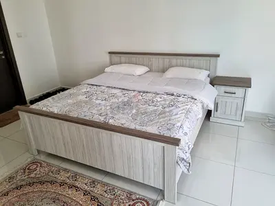 King size wooden bed with matching, wardrobe, chest of drawers and bedside table