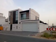 A modern independent villa located in Hoshi, Sharjah, offering luxury living with a prime location n