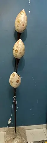 Tall three-light decorative floor lamp with shell-style shades