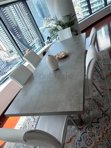 Modern rectangular dining table with 6 white chairs