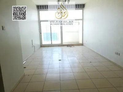 Two-bedroom apartment with a living room for sale in cash in Ajman One Towers, with an open view and a closed kitchen.