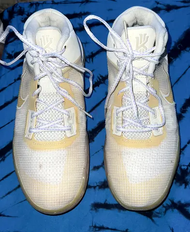 Used men’s white Nike Kyrie basketball shoes, size not specified