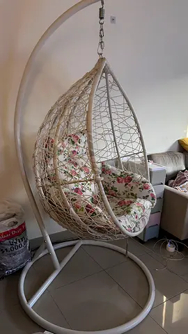 White Rattan Hanging Egg Chair with Floral Cushions