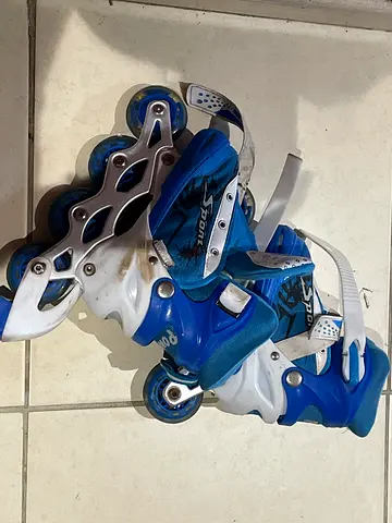 Blue adjustable inline roller skates - kids size, good condition