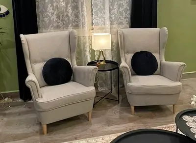 Pair of light grey wingback lounge chairs — good condition