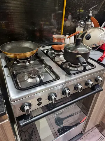 Used 4-Burner Stainless Steel Gas Cooker with Oven - Good Working Condition