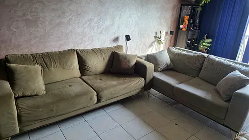 Two-piece olive green L-shaped sofa set, good condition