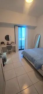 Fully furnished private bedroom with balcony available for a female tenant near metro station.