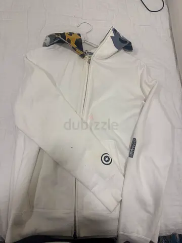 White zip-up hoodie with patterned hood lining, size medium