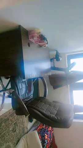 Black Leather Office Chair with Adjustable Height and Armrests