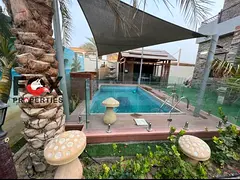 Luxury villa for sale in Al Rawda 3 Ajman, corner on two streets, private pool and garden, 5 master