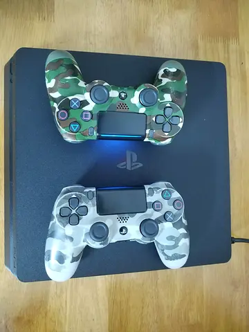 Sony PS4 Slim with 2 Camo DualShock Controllers, 500GB Storage - Good Working Condition