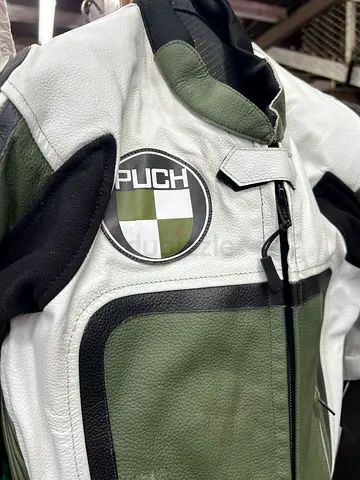 Used green and white Puch leather racing suit
