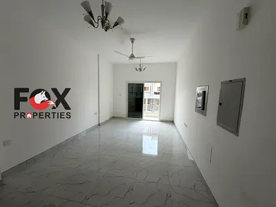 For rent in Ajman - Al Mowaihat 3, an apartment consisting of two rooms and a living room with two bathrooms and a balcony, with new central air condi